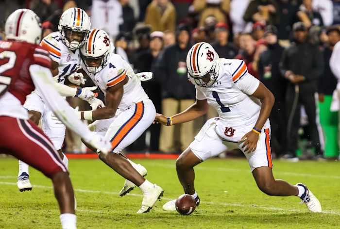 Nov 20, 2021; Columbia, South Carolina, USA; Auburn Tigers quarterback TJ Finley (1) recovers his own fumble against the South Carolina Gamecocks in the fourth quarter at Williams-Brice Stadium. Mandatory Credit: Jeff Blake-USA TODAY Sports